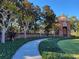 Picturesque community architectural feature with brick accents and lush greenery at 14474 Prunningwood Pl, Winter Garden, FL 34787