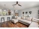 Spacious living room with an open concept design, comfortable sectional sofa, and modern decor at 14474 Prunningwood Pl, Winter Garden, FL 34787