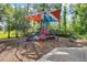 Colorful community playground with climbing structures, slides, and soft ground cover for safe play at 14474 Prunningwood Pl, Winter Garden, FL 34787