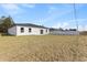 A nice backyard features a well-maintained lawn, a patio area, and a privacy fence for outdoor enjoyment at 16730 Sw 50Th Cir, Ocala, FL 34473