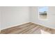 Bedroom with window, wood-look flooring, and neutral wall color at 16730 Sw 50Th Cir, Ocala, FL 34473