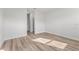 A bright bedroom showcases the wood-look flooring and neutral wall color at 16730 Sw 50Th Cir, Ocala, FL 34473