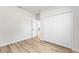 Spacious bedroom featuring ample closet space and wood-look flooring at 16730 Sw 50Th Cir, Ocala, FL 34473