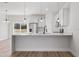 Bright kitchen features stainless appliances, a modern faucet, and a breakfast bar at 16730 Sw 50Th Cir, Ocala, FL 34473