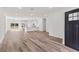 Bright and airy open-concept living space with wood flooring and modern finishes at 16730 Sw 50Th Cir, Ocala, FL 34473