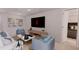 Cozy living room with modern decor, comfortable seating, and seamless access to the bedroom at 17445 Sw 25Th Ct, Ocala, FL 34473