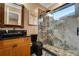 Contemporary bathroom with a glass-enclosed shower and dark fixtures at 1810 Oakbrook Dr, Longwood, FL 32779