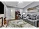 Bonus room showcasing a cozy seating area, recreational equipment, and adjacent bathroom at 1810 Oakbrook Dr, Longwood, FL 32779