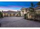 Home featuring a paved driveway leading to a spacious three-car garage with an arched entryway at 1810 Oakbrook Dr, Longwood, FL 32779