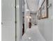 Well-lit hallway with white marble floors and views into adjacent rooms at 1810 Oakbrook Dr, Longwood, FL 32779