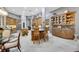 Bright kitchen features a large island with seating and beautiful cabinets for storage and display at 1810 Oakbrook Dr, Longwood, FL 32779