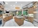 Spacious kitchen with custom cabinets, granite countertops, stainless steel appliances, and marble floors at 1810 Oakbrook Dr, Longwood, FL 32779