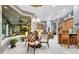 Inviting kitchen with island and seating, marble floors, and natural light from the window at 1810 Oakbrook Dr, Longwood, FL 32779