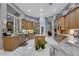 Spacious kitchen featuring stainless steel appliances and an island with a marble countertop at 1810 Oakbrook Dr, Longwood, FL 32779