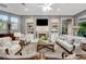 Comfortable living room with a fireplace, built-in shelves, and ample seating at 1810 Oakbrook Dr, Longwood, FL 32779