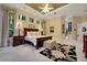 Spacious primary bedroom featuring a decorative ceiling, large windows, and ensuite bath at 1810 Oakbrook Dr, Longwood, FL 32779