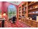 Sophisticated home office with custom built-ins, natural light, and elegant decor at 1810 Oakbrook Dr, Longwood, FL 32779