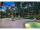 Enclosed patio with screened-in pool, spa, and lush landscaping offers a private outdoor oasis at 1810 Oakbrook Dr, Longwood, FL 32779