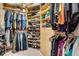 Organized walk-in closet with shelves, drawers, and hanging space for clothing and accessories at 1810 Oakbrook Dr, Longwood, FL 32779
