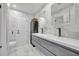 Elegant bathroom with double sinks, modern cabinetry, and beautiful marble tile throughout at 1850 Shawnee Trl, Maitland, FL 32751