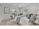 Comfortable bedroom featuring neutral tones, plush bedding, and natural light from two windows at 1850 Shawnee Trl, Maitland, FL 32751