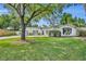 Charming home featuring a well-maintained lawn and inviting curb appeal with mature trees and landscaped surroundings at 1850 Shawnee Trl, Maitland, FL 32751