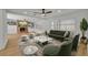 Spacious living room featuring a decorative fireplace, modern furniture, and bright natural light at 1850 Shawnee Trl, Maitland, FL 32751