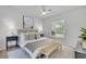 Relaxing main bedroom with neutral decor, soft lighting, and a large window overlooking the lush outdoors at 1850 Shawnee Trl, Maitland, FL 32751