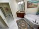 Bright bathroom featuring a jacuzzi tub and decorative art at 1925 S Atlantic Ave # 411, Daytona Beach, FL 32118