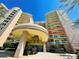 Elegant condominium entry highlighting the upscale architecture and landscaped grounds at 1925 S Atlantic Ave # 411, Daytona Beach, FL 32118