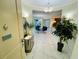 A condo foyer boasts marble floors, recessed lighting, and leads to the dining and living areas at 1925 S Atlantic Ave # 411, Daytona Beach, FL 32118