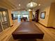 Spacious game room featuring a pool table and ample seating, perfect for entertaining guests at 1925 S Atlantic Ave # 411, Daytona Beach, FL 32118