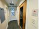 Hallway featuring access to the building's sauna with warning sign at 1925 S Atlantic Ave # 411, Daytona Beach, FL 32118