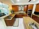 Spacious kitchen with stainless steel appliances, granite countertops, and tile backsplash at 1925 S Atlantic Ave # 411, Daytona Beach, FL 32118