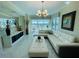 Bright living room featuring modern decor, sleek furniture, and balcony access for stunning views at 1925 S Atlantic Ave # 411, Daytona Beach, FL 32118