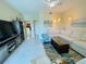 Living room with a large sectional sofa, stylish decor, and tiled flooring, offering a relaxed and inviting atmosphere at 1925 S Atlantic Ave # 411, Daytona Beach, FL 32118