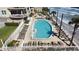 Outdoor pool overlooking the ocean with lounge chairs and beach access at 1925 S Atlantic Ave # 411, Daytona Beach, FL 32118