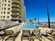 Relaxing poolside with lounge chairs, overlooking the ocean on a clear day at this condo community at 1925 S Atlantic Ave # 411, Daytona Beach, FL 32118