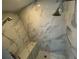 Modern shower featuring marble tiling, dual shower heads, and a built-in bench at 1925 S Atlantic Ave # 411, Daytona Beach, FL 32118
