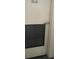 Interior view of white storage door with vent and handle at 1925 S Atlantic Ave # 411, Daytona Beach, FL 32118