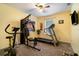 Bedroom with ceiling fan, carpeted floor, and a large window providing natural light at 2063 Killinger St, Deltona, FL 32738