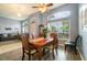 Charming dining area featuring hardwood floors and natural light through large windows at 2063 Killinger St, Deltona, FL 32738