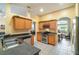 Well-lit kitchen with stainless steel appliances and wood cabinets at 2063 Killinger St, Deltona, FL 32738