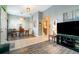 Open-concept living and dining area featuring tile and wood laminate flooring at 2063 Killinger St, Deltona, FL 32738