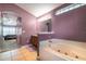 Modern main bathroom with a large tub and separate shower at 2063 Killinger St, Deltona, FL 32738