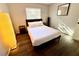 Bedroom with hardwood floors, large window, and neutral paint tones at 2357 Rio Pinar Lakes Blvd, Orlando, FL 32822