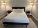 Serene bedroom featuring a comfortable bed, two bedside tables with lamps, and neutral decor at 2357 Rio Pinar Lakes Blvd, Orlando, FL 32822