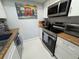 Kitchen with stainless steel appliances, granite countertops, and ample cabinet space at 2357 Rio Pinar Lakes Blvd, Orlando, FL 32822