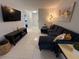 Cozy living area featuring a large sectional couch, TV, and stylish decor at 2357 Rio Pinar Lakes Blvd, Orlando, FL 32822