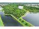 Aerial view of retention pond and trees at 2620 Waterline St, Kissimmee, FL 34743